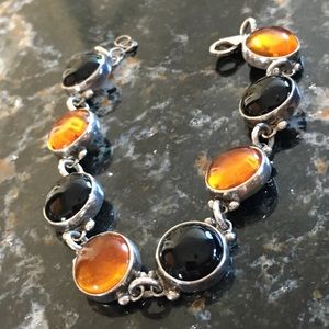 Silver and stone bracelet. Black and orange/rust
